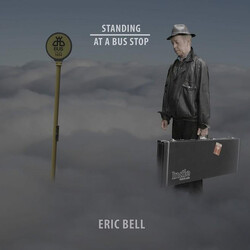 Eric Bell (2) Standing At A Bus Stop